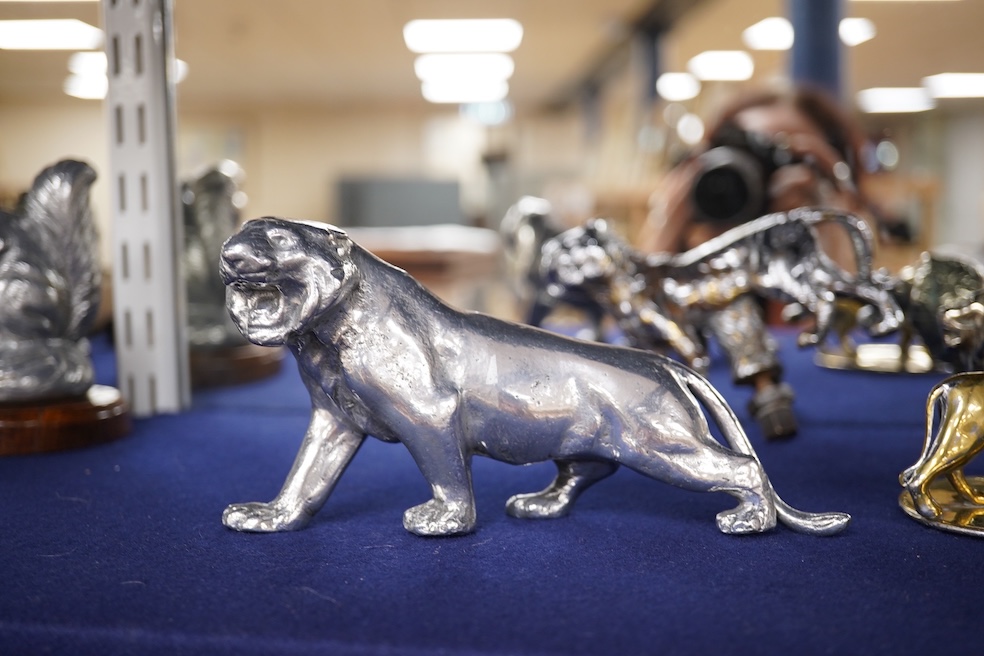 Four lion and big cat related brass and chrome car mascots/figures, consisting of two lions, a tiger and another, possibly a panther. Condition - fair, some losses to chrome.